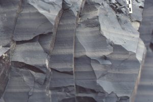 Slope facies as shown above, Icebox Canyon, Bowser Basin. Thin, sharp-based, graded very fine sandstone-siltstone and laminated shale.