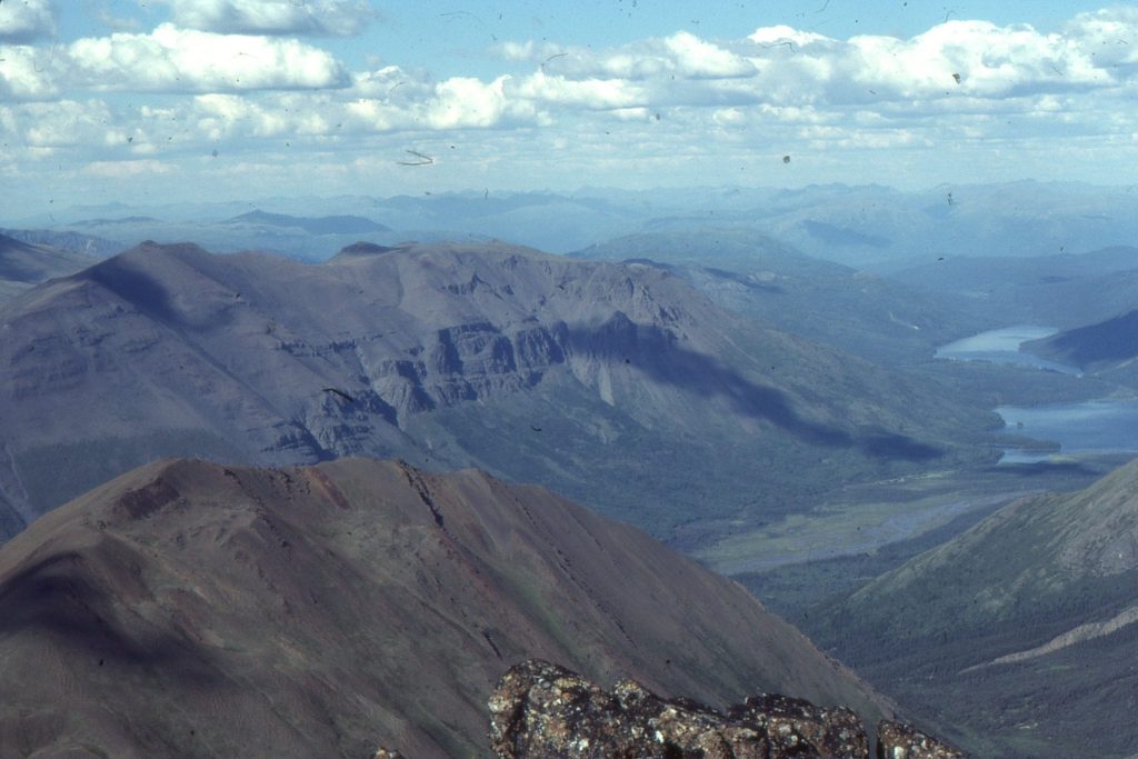 Mid-view ridge, stacked submarine channels (resistant dark grey units) in Middle Jurassic slope deposits, Bowser Basin, British Columbia. Details of these channels are illustrated below.