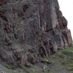 The base of the Todagin submarine slope channel complex and bedded conglomerate-fill, most of which was deposited by debris flows, sometimes separated by thin turbidites. View shows about 25m of section. Bowser Basin, British Columbia.