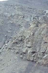 Stacked channel conglomerate in the slope channel complex; the channel margin is almost vertical through about 20m thickness. The steep margin may be synsedimentary fault controlled - the overlying beds are not displaced. Opposite the margin are typical slope mudrocks and thin turbidites. Bowser Basin, British Columbia.