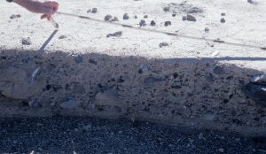 Section through a recent flash flood, hyperconcentrated flow, Death Valley. Texturally, the flow resembles a muddy debris flow; poorly sorted, mud-support of clasts, but the range of clast-sizes is much smaller.