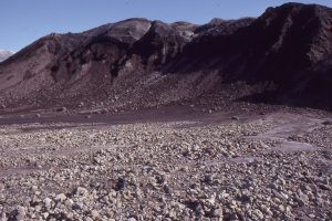 Mixed sediment and ice at the snout of Strand Glacier, Axel Heiberg Island, concentrated by ablation and melting. Mechanical sorting of sediment only begins in the outwash fan.