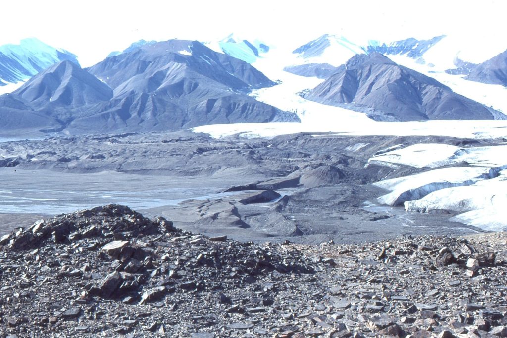 Terminal moraines and outwash braidplain ahead of a retreating Strand Glacier, Axel Heiberg Island, as it was in 1983.