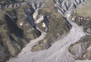 Headwaters of active alluvial fans in Tertiary Hills, Northwest Territories.  Bedrock here is Paleocene fluvial conglomerate, sand and sub-bituminous coal, that is being recycled by modern alluvial-fluvial drainage. Clast-size range in the fans is determined by the clast sizes in the eroding conglomerates.