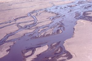 The closer view of the river shown above shows a bit more detail of channel bar surface features exposed at low water. The sediment load is mixed sand-gravel.