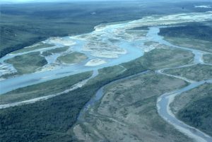 Bonnet-Plume River (Yukon) braided reaches, that, unlike high Arctic examples, are framed within vegetated overbank and some inactive gravel bars. The sediment load is mixed sand-gravel. The view also shows an ephemeral meandering reach that cuts through inactive braid-bars (lower right).