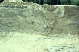 Glacial outwash channel deposits deformed by ice loading. Deformation took place in slump packages and along small faults.