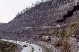 Broader view of thin crevasse splay (people standing on it), overlain here by accretionary point-bar foresets that dip to the right.  Betsy Layne, Kentucky