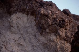 Debris flow overlying and eroding thinly bedded lacustrine silt-sand-mudstones.