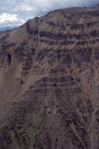 Clear discordances between foreset conglomerate beds, and topset conglomerates in fan deltas at  Tsargoss Lake, Bowser Basin.