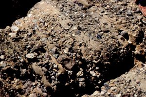 A variation on the debris flow theme, with well stratified conglomerate and commonly clast-supported frameworks (multiple flow units), that are inferred to have formed from more fluid flows than their pebbly mudstone counterparts. Upper Cretaceous Pigeon Point, California.