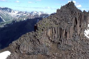 The Mount Edziza volcanic field in Stikine, northern British Columbia began erupting 7.5 million years ago, and continued into the Pleistocene. It features large stratovolcanoes, calderas and cinder cones. Featured here is a stairway of jointed basalts.