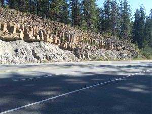 Another view of tiered, columnar jointed flows overlying Coast Mountain granodiorite. About 10 km north of Squamish, on Highway 99