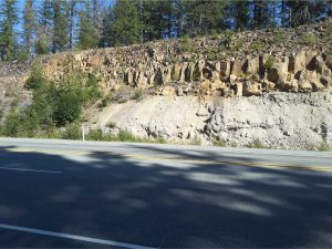 A tiered, columnar jointed flows overlying Coast Mountain granodiorite. About 10 km north of Squamish, on Highway 99