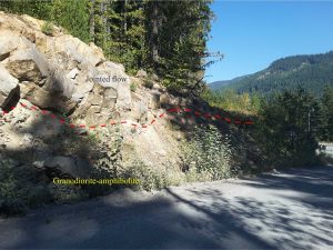 Jointed andesitic-dacitic overlying pre-existing, sub-glacial topography on eroded Coast Mountains granodiorite and metamorphic rocks. The contact is shown in red on the left image. Right image: detail of the bedrock, that here contains structurally interleaved and sheared granodiorite and amphibolite. About 10km north of Squamish, Highway 99.