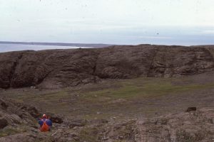 Jointed lava flows and wrap-around piles of pillow lavas on Flaherty Island. Outcrops often permit the 3-dimensional geometry of flows and pillows to be mapped. Flow top dips almost vertical here.