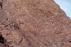 Curved and radiating entablature joints in Cretaceous Strand Fiord basalt flows, Axel Heiberg Island. 