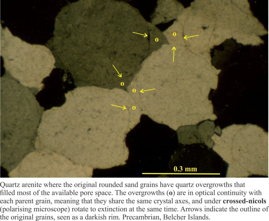 Quartz arenite with well developed syntaxial quartz overgrowths. Original grain boundaries outlined by dust inclusions