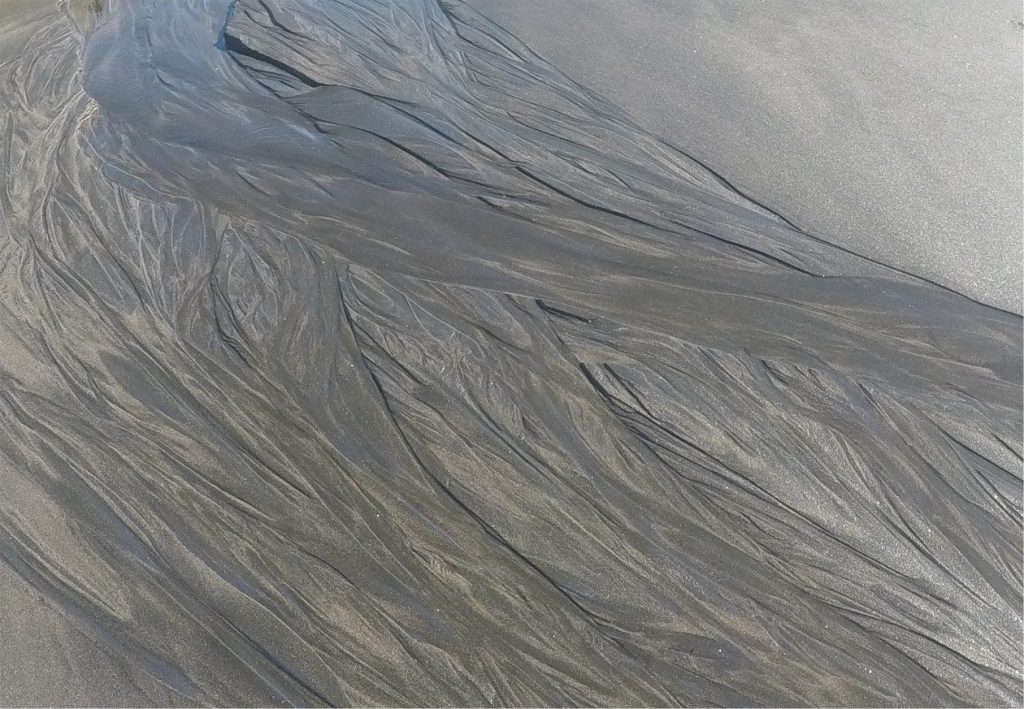 Typical braided channel patterns reflect active channel migration and avulsion, mid-channel bars and chute cutoffs. The latest channels (top if the braidplain) cut across earlier channel reaches. Field of view 1.2 m.