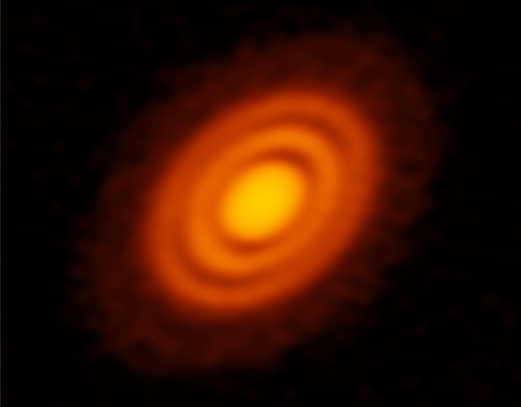 An other-worldly view of a young star (HD163296) and its planetary disc, imaged by the Atacama Large Millimetre Array (ALMA). The disc is a nursery for accreting planets. The dark bands, or gaps may represent regions of nascent planet accretion. Like fully-fledged solar systems, the separation of dust-gas gaps appear to conform to harmonic resonances. The system is 398 light years away. Image Credit: ALMA (ESO/NAOJ/NRAO); A. Isella; B. Saxton (NRAO/AUI/NSF)  